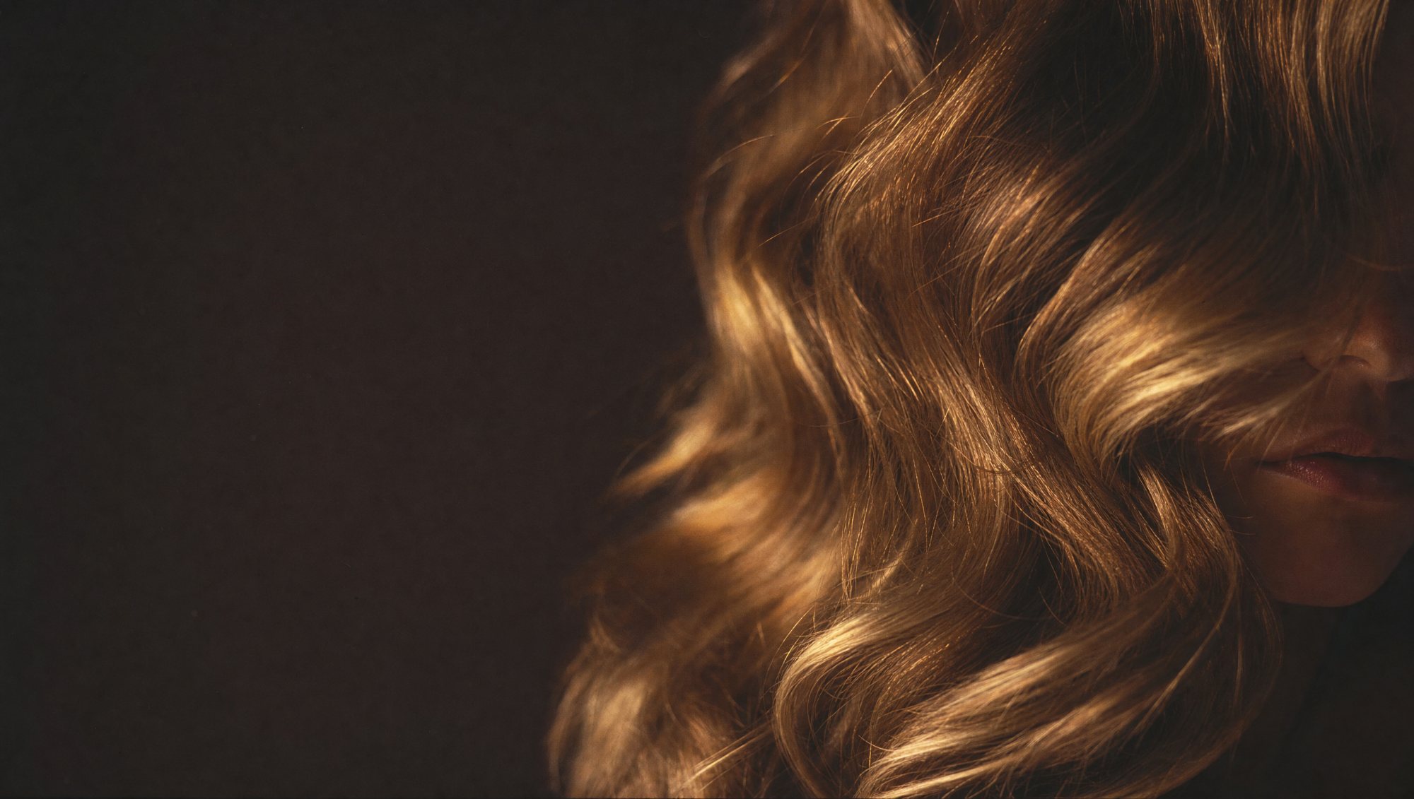 Glossy styled hair in warm golden light